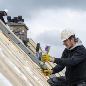 Roofing team working at height